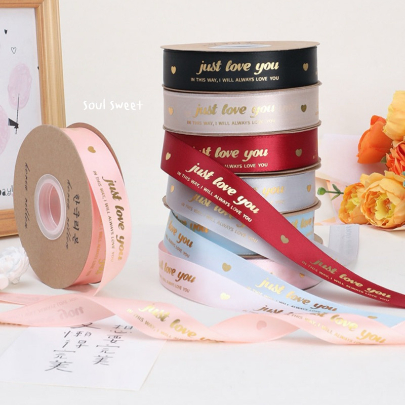 ริบบิ้นผ้าซาตินพิมพ์ลายทอง just love you กว้าง 2.5 cm ยาว 45 หลา
