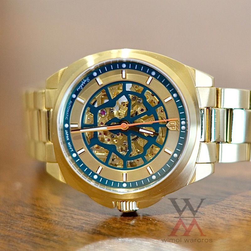 นาฬิกา OP (Olym Pianus) รุ่น 9935-4AM - Sapphire Automatic สิงห์เปลือย (หน้าทอง/เขียว-สายทอง)