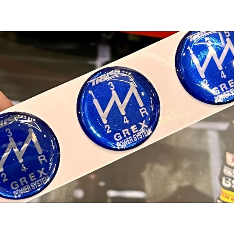 สติ๊กเกอร์หัวเกียร์ รถยนต์ ลาย Greddy trust grex สติ๊กเกอร์หัวเกียร์ 5 เกียร์ สีน้ำเงิน เรียบหรู มีมิติ