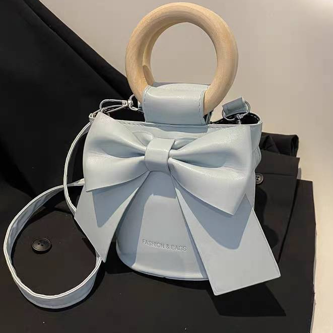 กระเป๋าหน้าโบว์   กระเป๋าสไตส์เกาหลีน่ารักหูจับไม้  เเบบใหม่ทรงถังสไตส์สาวหวาน - รูปที่ 2
