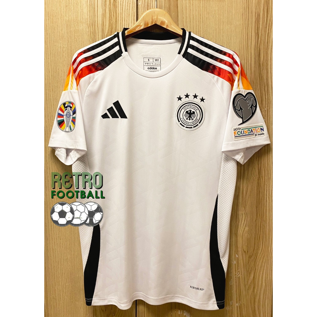 เสื้อฟุตบอล ทีมชาติเยอรมัน Home ชุดเหย้า ยูโร 2024 เกรดแฟนบอล [ 3A ]  สีขาว เสื้อเปล่าพร้อมอาร์ม ยูโร 2ข้าง