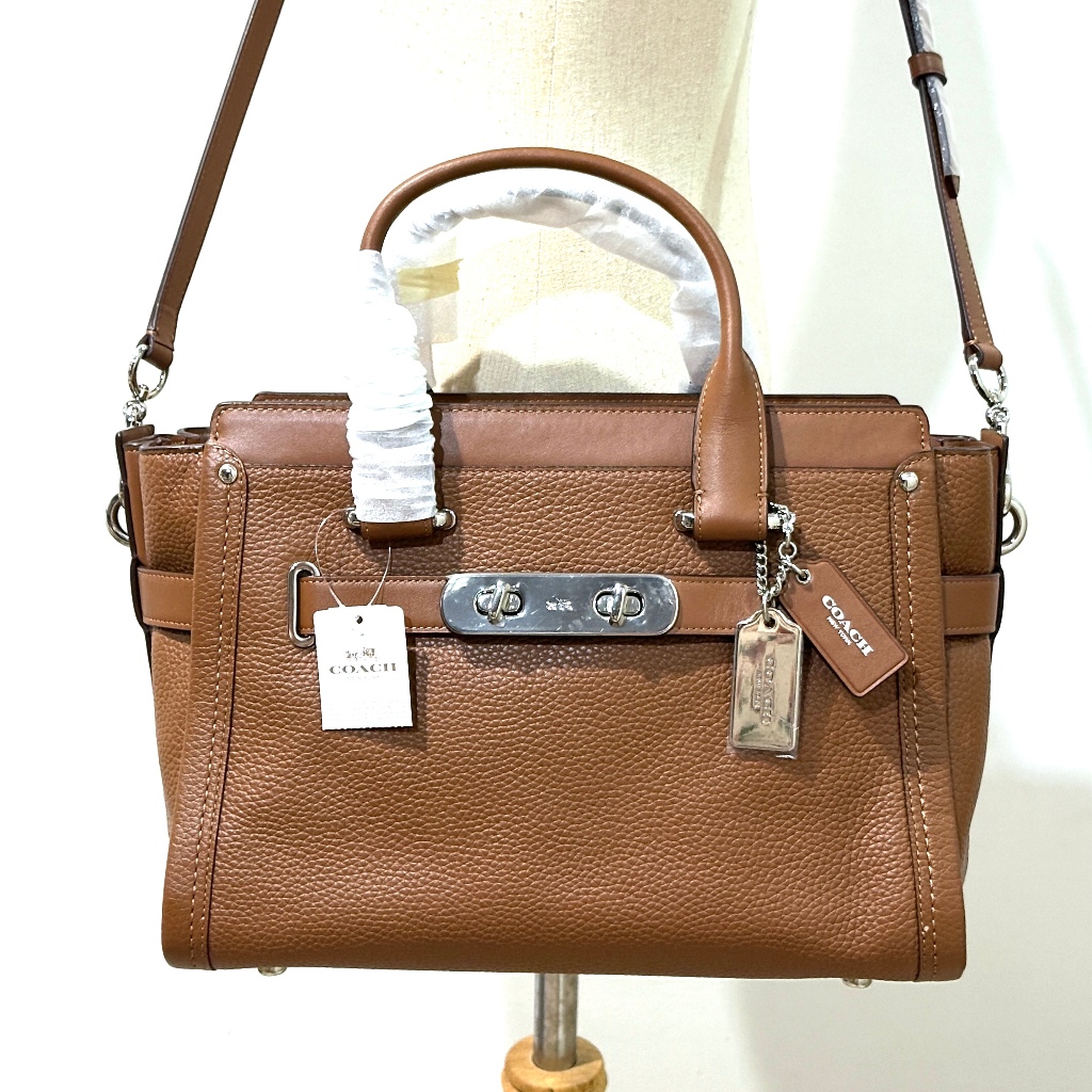 กระเป๋าถือ Coach ของแท้ มือ 1 รุ่นหรูที่สุด COACH 34408 SWAGGER 32 IN PEBBLE LEATHER BAG  Saddle