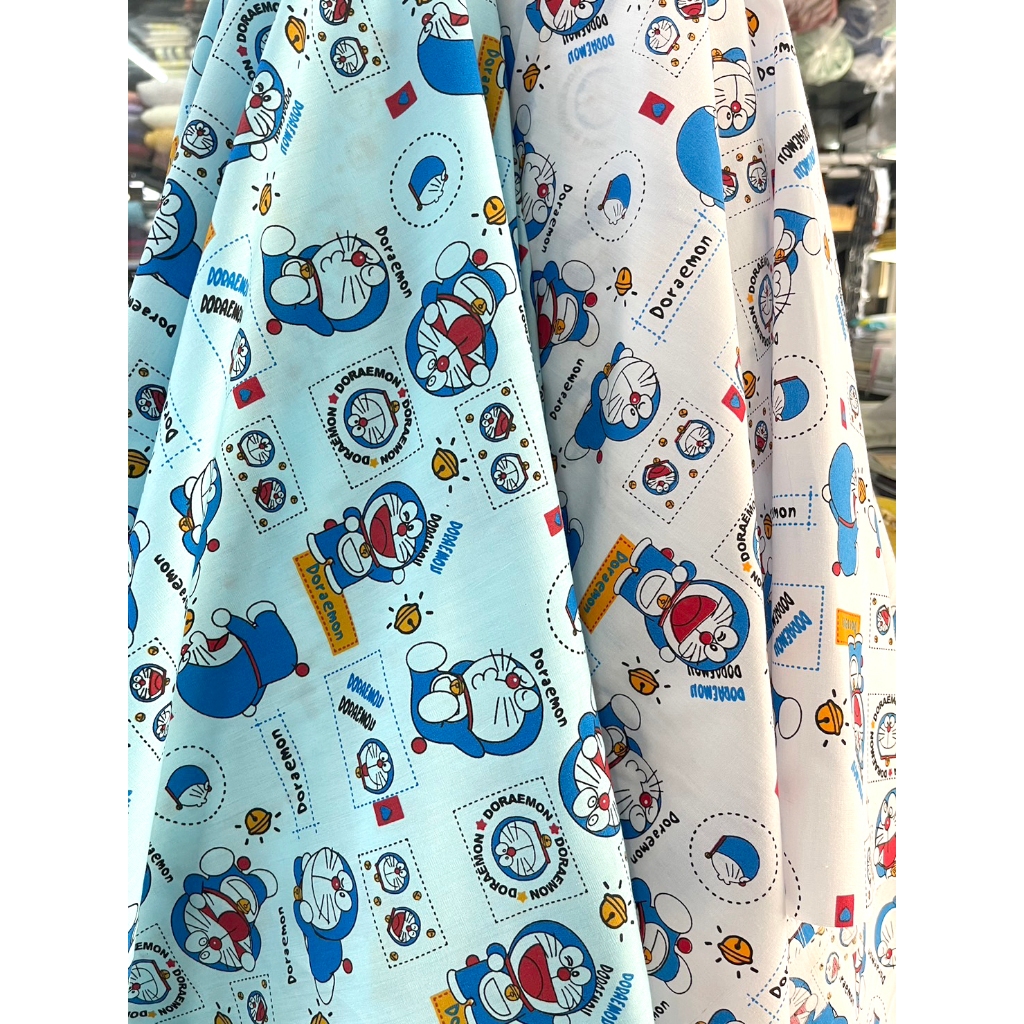 ผ้าทีซีคอตต้อน ลายการ์ตูน โดเรม่อน หน้ากว้าง 44 นิ้ว หน่วยขายเป็นเมตร