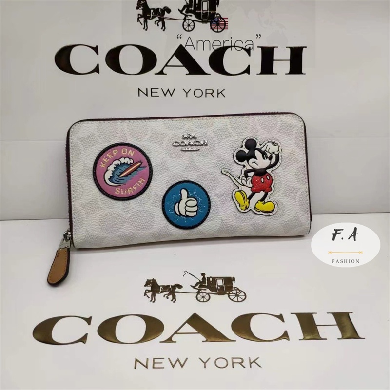 F.A ว่าแท้100% coach แท้  Disney Cooperation กระเป๋าสตางค์ผู้หญิง ซิปยาว ลายมิกกี้ สีขาว ตราการ์ตูน ขี้เล่นและน่ารัก