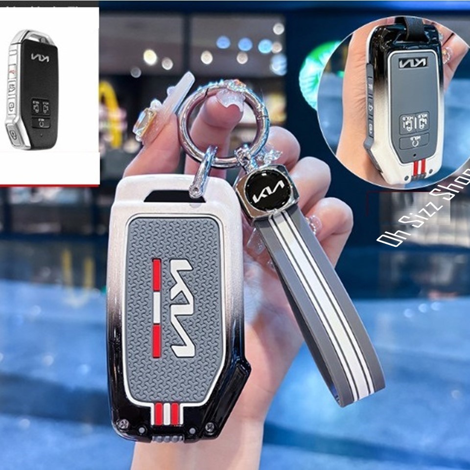 เคสรีโมท KIA Carnival 2024   งานโลหะสีขาวไล่เทาดำ (Black White Alloy Silicone Push button Guard)