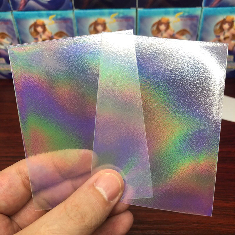 Outer Sleeves Rainbow Foil - ซองใส่การ์ดชั้นนอก แบบฟรอยรุ้ง หน้าใส-หลังขุ่น ( 1 แพค = 50 ซอง ) ขนาด 69x94 mm
