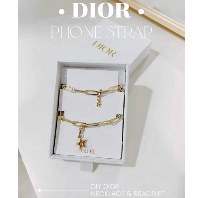 Dior gold phone charm