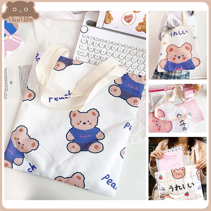 [พร้อมส่ง] กระเป๋าผ้าน่ารัก(ไม่มีซิป) มี 5 แบบ สกรีนตัวการ์ตูน ขนาด 33.5x35 ซม. ใส่ของได้เยอะ : MiniMilwʕ•ᴥ•ʔ
