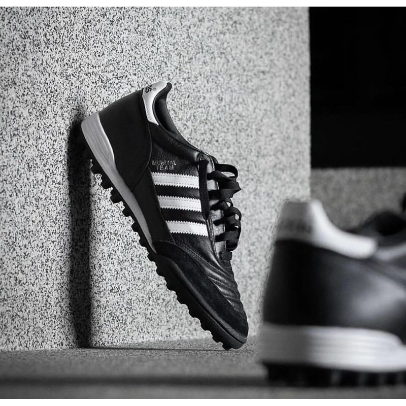 รองเท้าฟุตบอลหญ้าเทียม 100 ปุ่ม ADIDAS MUNDIAL TEAM (สินค้าลิขสิทธิ์แท้มือ1💯%)