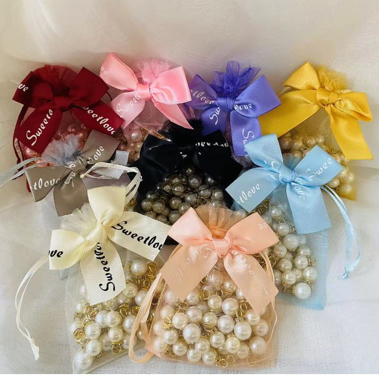 ราคาถูก ถุงผ้าแก้วโปร่งใส หูรูด ติดโบว์น่ารัก มีหลายสีหลายขนาด พร้อมส่งในไทย