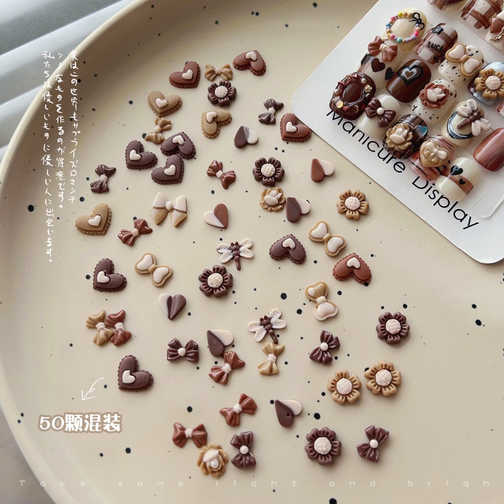 เรซิ่น อะไหล่ตกแต่งเล็บ การ์ตูนเรซิ่น ดอกทานตะวัน โบว์ ดอกไม้ หัวใจช็อกโกแลต  Maillard คละแบบ 50ชิ้น
