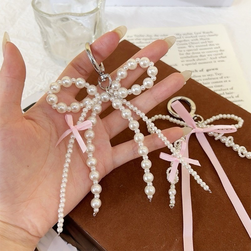 🎀🤍พร้อมส่ง!พวงกุญแจผูกโบว์ ไข่มุก ห้อยกระเป๋า โทรศัพท์ น่ารักมาก