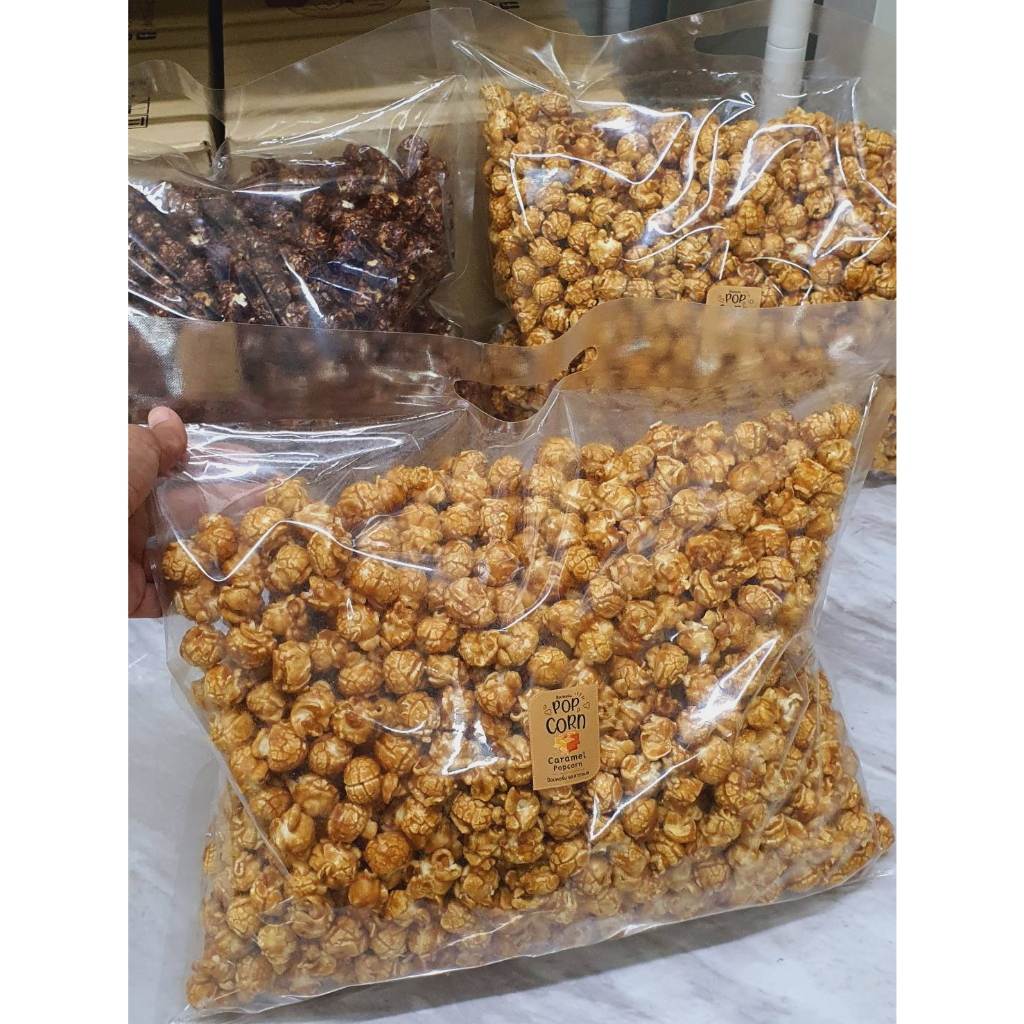ป๊อบคอร์น J-Deli ถุงใหญ่ 1 กิโลกรัม แบ่งย่อยเป็นสองถุง ถุงละ 450-500 กรัม มี 4 รส คาราเมล ช็อกโกแลต ชีส สตรอเบอร์รี่
