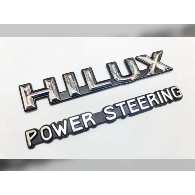 โลโก้ hilux + powersteering ชุด 2 ชิ้น ของรุ่น mighty