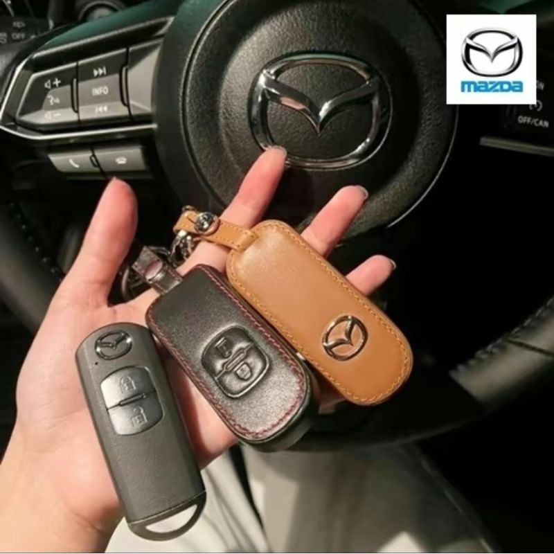 ซองหนังแท้ ใส่กุญแจรีโมทรถยนต์ รุ่นหนังนิ่มโลโก้-เงิน Mazda 2,3/CX-3,5 Smart Key 2 ปุ่ม