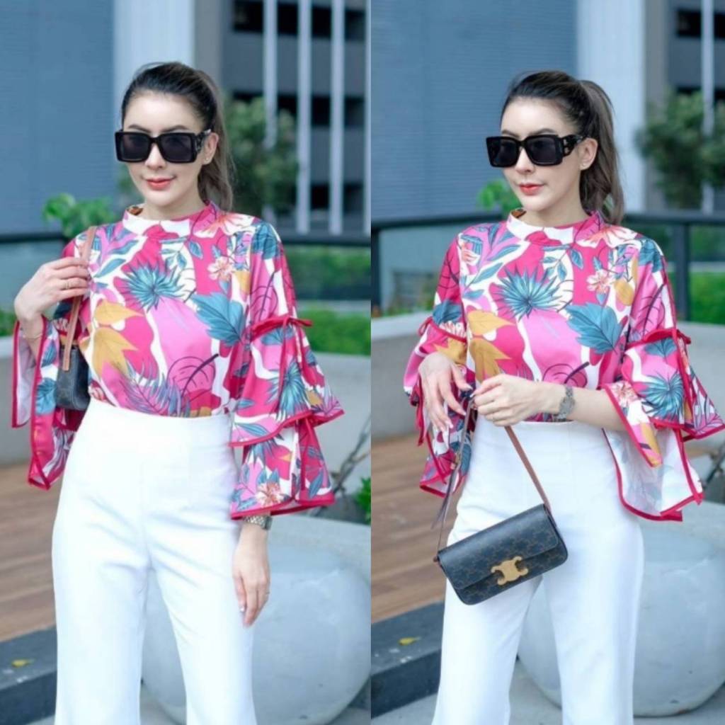 เสื้อคอต้ัง เสื้อผู้หญิง กุ๊นแขนระบาย2ขั้น แขนผ่าผูกโบว์ด้านข้างที่แขนทั้ง2ข้าง ด้านหลังแต่งคอด้วยกระดุมมุก สวยมากก