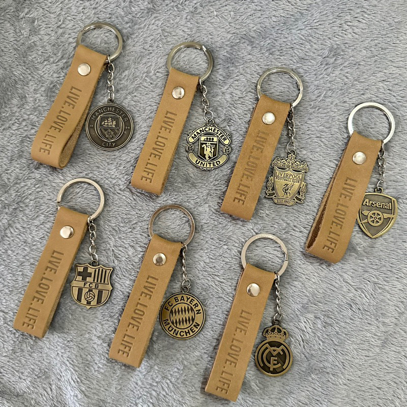 พวงกุญแจหนังแท้ (Keychain) พร้อมโลโก้ทีมฟุตบอล ใช้สำหรับห้อยกระเป๋า ห้อยกุญแจรถ