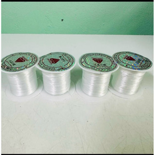 ไหมยืด ม้วนเล็ก สำหรับร้อยหิน ยาว 10 เมตร เส้นแบน หนา 0.5 มิ…