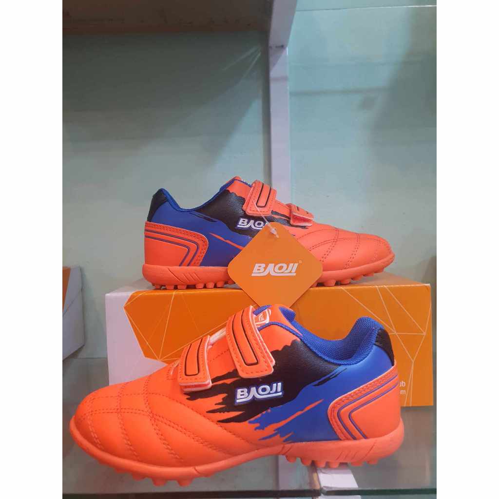 รองเท้าฟุตบอลเบาจิ 100ปุ่มสำหรับเด็ก เล่นสนามหญ้าเทียม