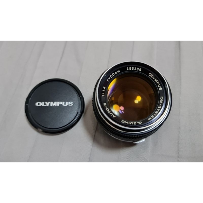 เลนส์มือหมุน Olympus 50mm F1.4 (ขอบเงิน)