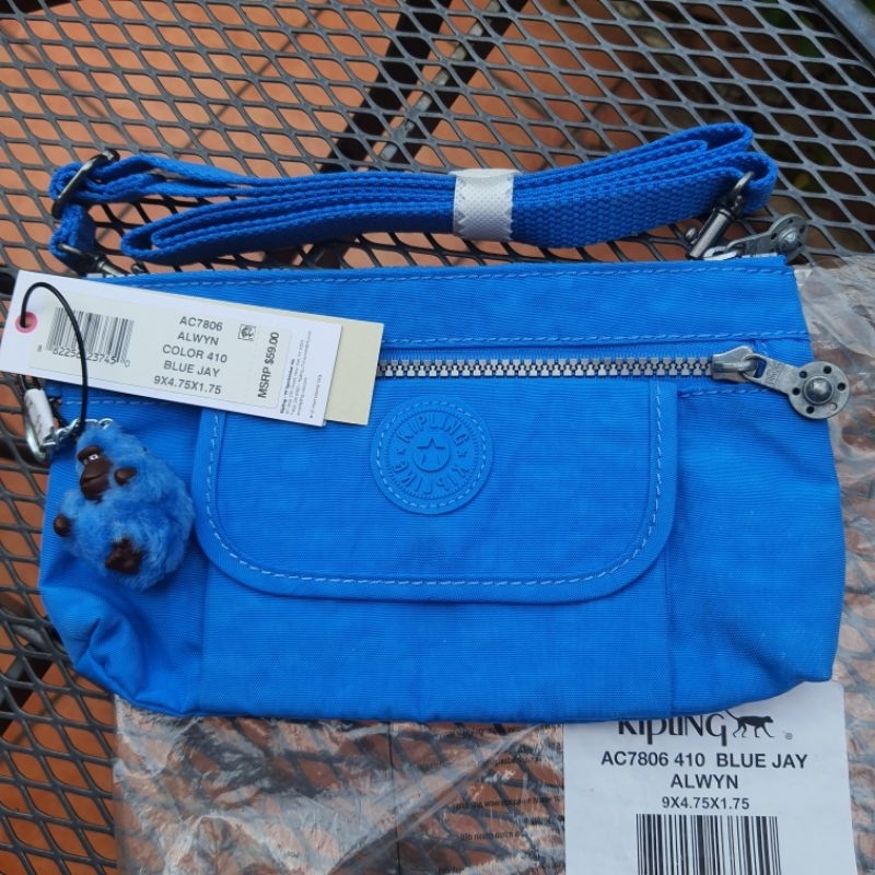 กระเป๋าสะพายข้าง Kipling รุ่น Alwyn สี Blue Jay ขนาด 9x4.75x1.75 นิ้ว ของแท้จาก USA.