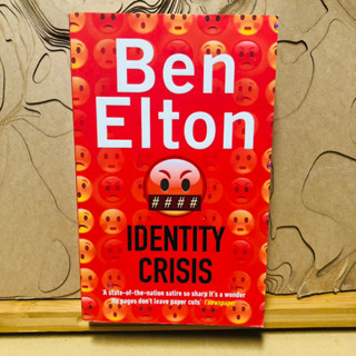 ข308 Ben Elton IDENTITY CRISIS A state-of-the-nation satire so sharp its a wonder its pages dont leave paper cut