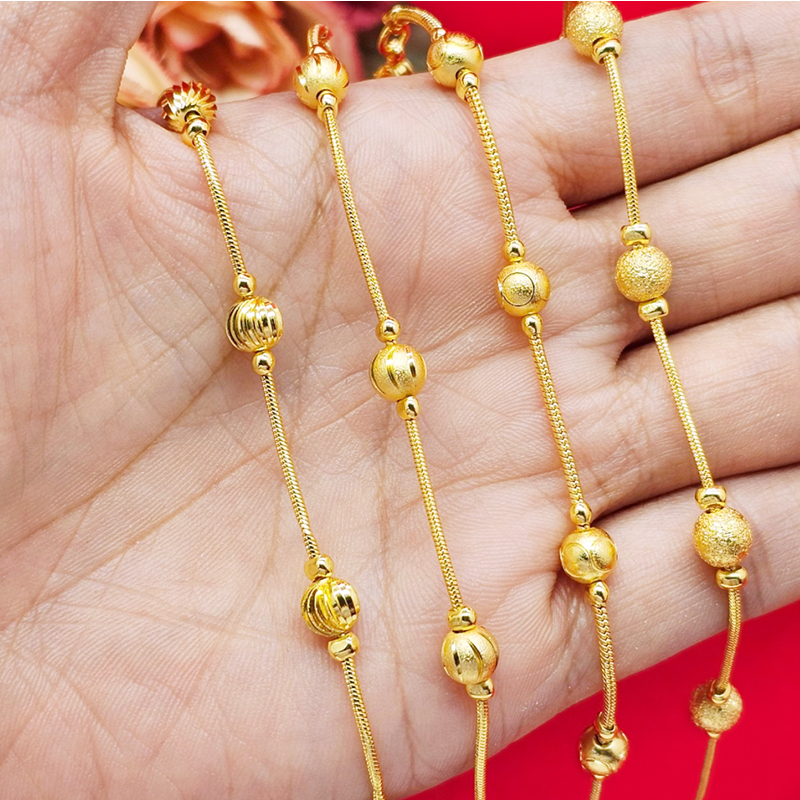 สร้อยข้อมือทองลายกระดูกงูกลมคั่นเม็ดบอล ความยาว 6-6.5 นิ้ว ชุบทอง ทองปลอม ทำจากทองเหลือง ใส่ได้ทุกโอกาส ใส่อาบน้ำได้