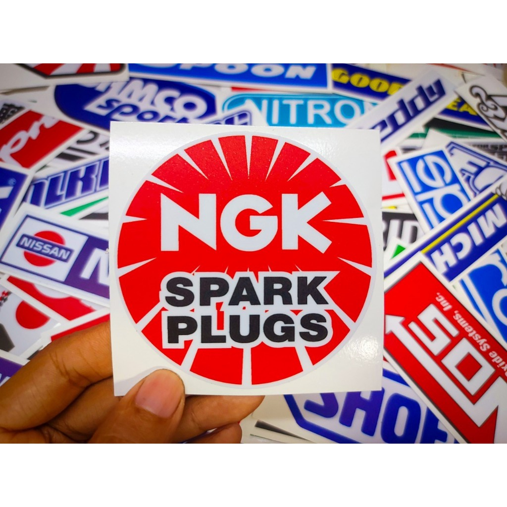 สติ๊กเกอร์ติดรถ NGK เคลือบกันรอย กันน้ำ เกรด 2 ปี ขนาด 8.5x8.5 เซนติเมตร l NGK Sticker