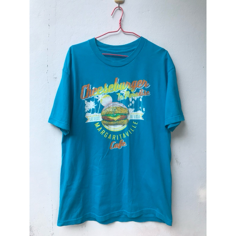 มือ 2 ซักแล้ว size L MARGARITAVILLE สีฟฟ้่น้ำทะเล สกรีน หน้าหลัง