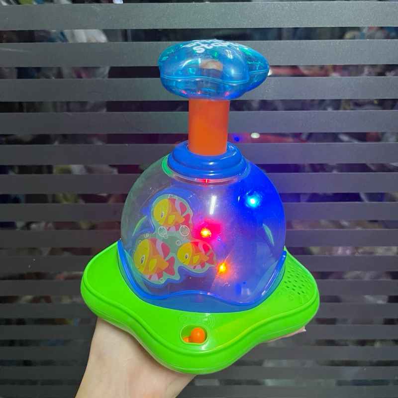 Bright Starts Press &amp; Glow Spinner Cause and Effect Musical Baby Toy ของเล่นเสริมพัฒนาการ ของเล่นกดหมุน มีไฟ **มือสอง**