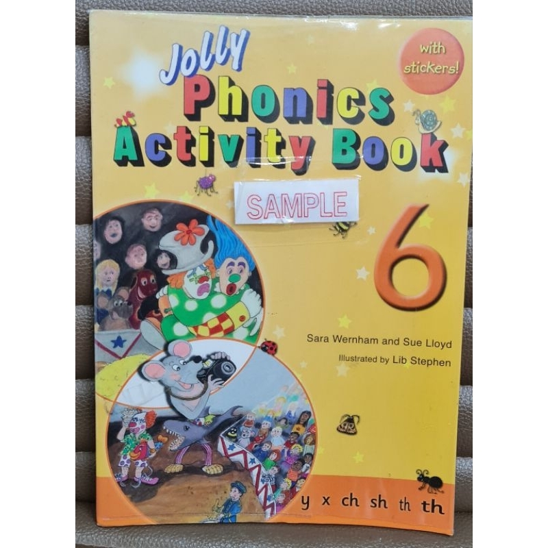 Used Jolly Phonics activity book 6 เป็นหนังสือตัวอย่าง มีแสตมป์คำว่า Sample ทุกหน้าแต่สติ๊กเกอร์ยังอ