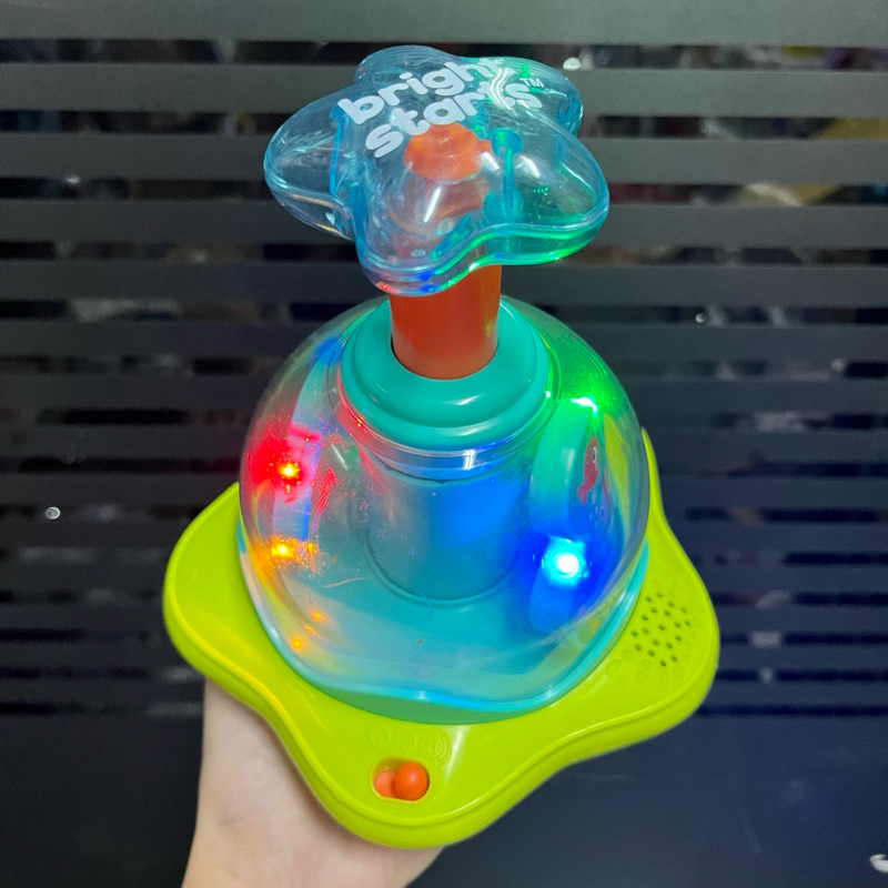 Bright Starts Press &amp; Glow Spinner Cause and Effect Musical Baby Toy ของเล่นเสริมพัฒนาการ ของเล่นกดหมุน มีไฟ **มือสอง**
