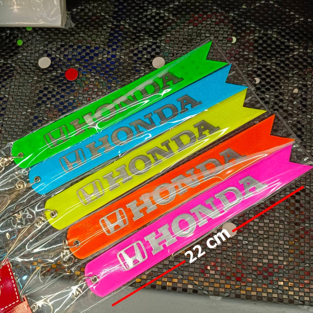 HONDA ริ้บบิ้นห้อยท้ายรถยนต์ สะท้อนแสงป้องกันอุบบัตติเหตุ เขียนโลโก้ HONDA (ยาว 22 cm.) สินค้าส่งในประเทศ