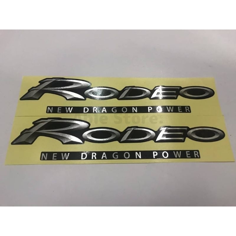 สติ๊กเกอร์ดั้งเดิมรถคำว่า RODEO THE NEW DRAGON POWER ฟอยขนแมวขอบสีดำ ติดข้างแค๊ป รถกระบะ ISUZU RODEO