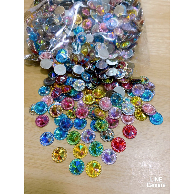 เพชรรุ้งคละสี ขนาด 12 มิลบรรจุถุงละ100ชิ้นตกแต่งชิ้นงานงานฝีมือ