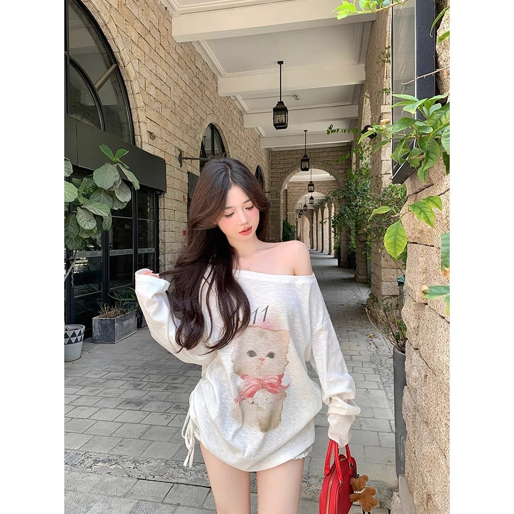 น่ารักแมวเอียงไหล่เสื้อกันหนาวสีขาวผู้หญิงต้นฤดูใบไม้ร่วง 2026 ใหม่บริสุทธิ์ปรารถนาหวานร้อนออกแบบความรู้สึกแขนยาวด้านบน