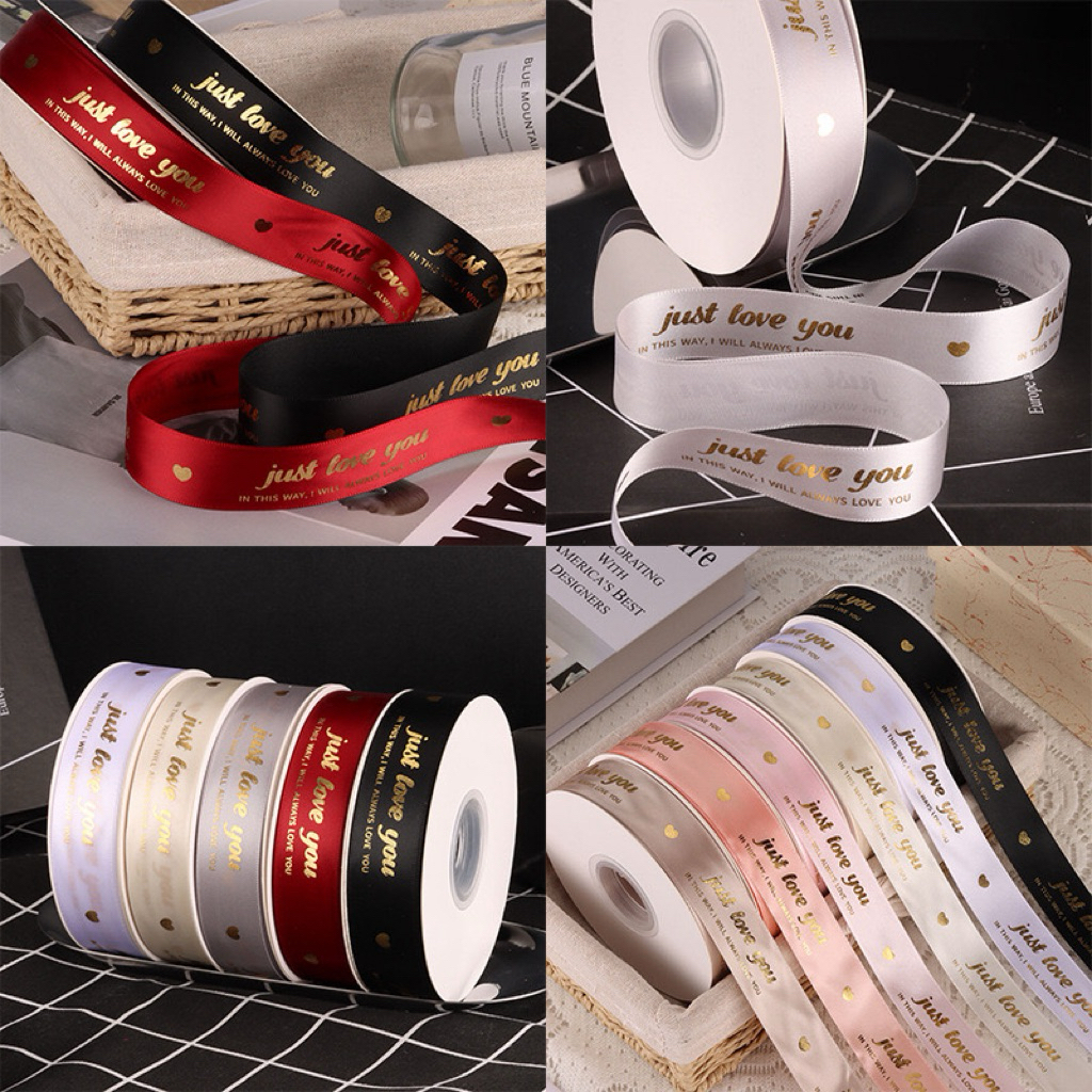 ริบบิ้นผ้าซาตินพิมพ์ทอง อักษรภาษาอังกฤษ กว้าง 2.5 cm ยาว 40 หลา