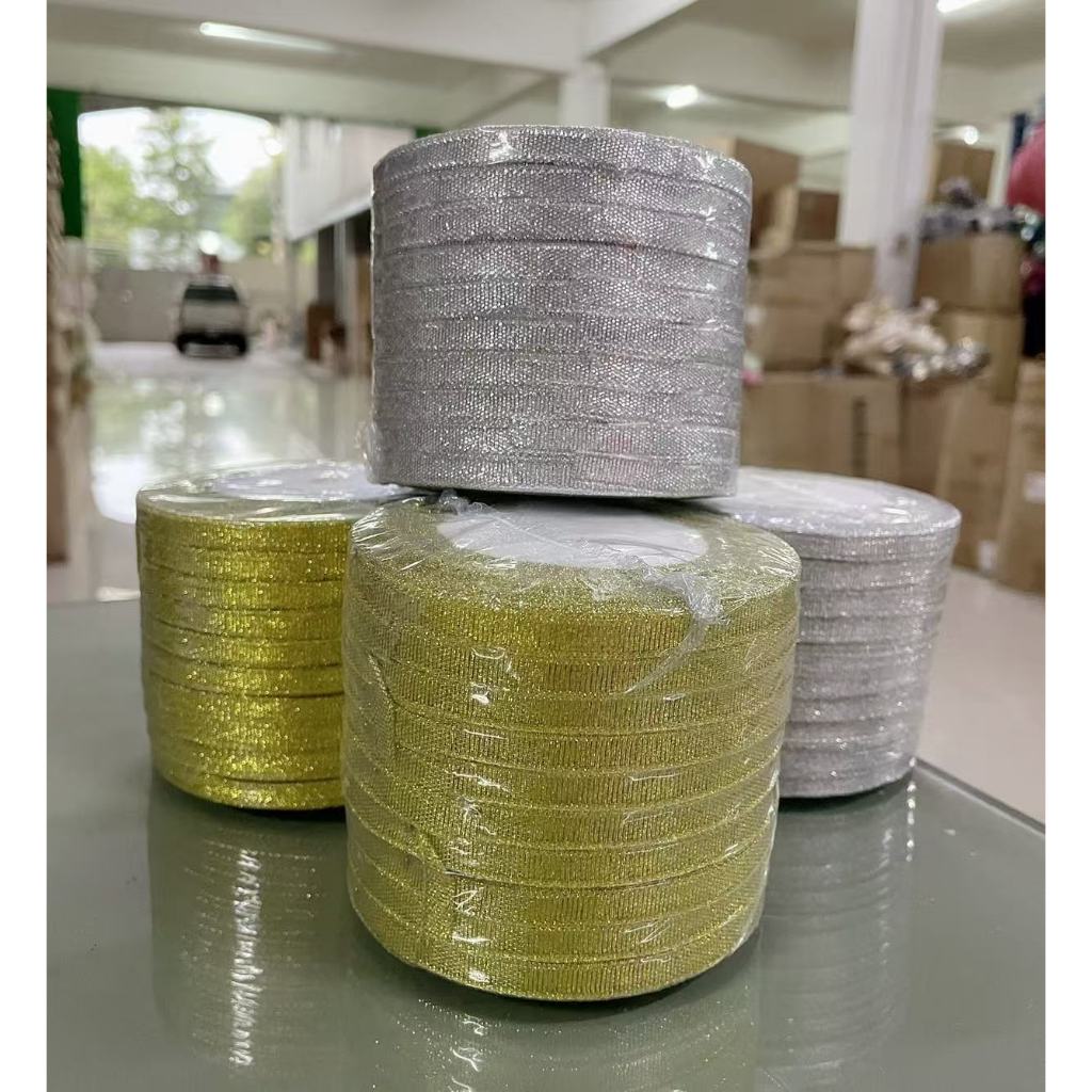 ริบบิ้นทรายสีเงิน_ทอง7มิล(1/4 jin condai)