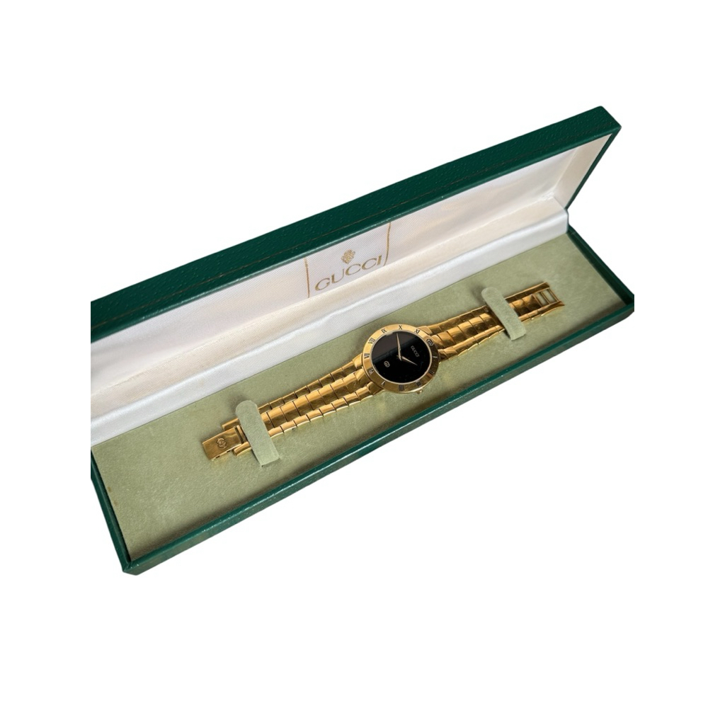 vintage Gucci watch in gold