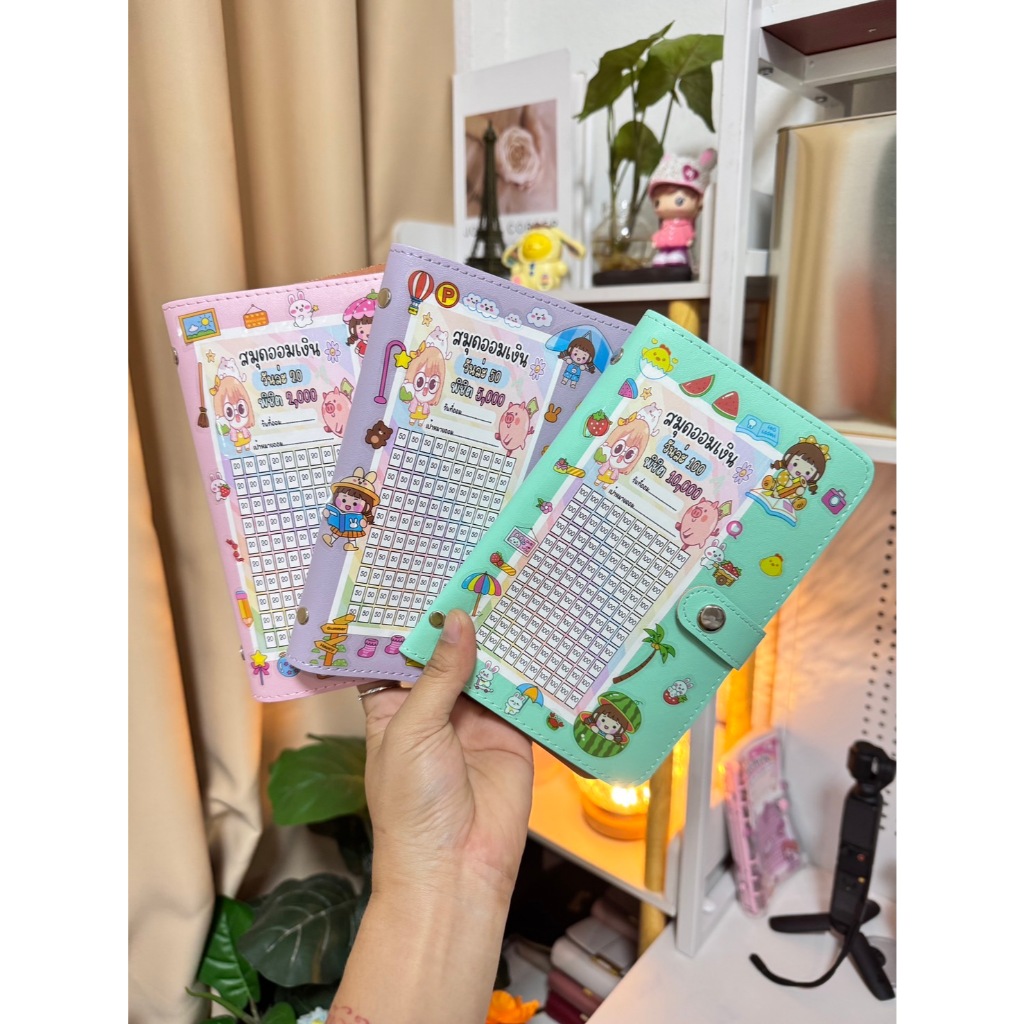 สมุดออมเงินรายวัน 100 ช่อง พร้องตารางออมและสติกเกอร์ตกแต่ง แถมปากกา1แท่ง