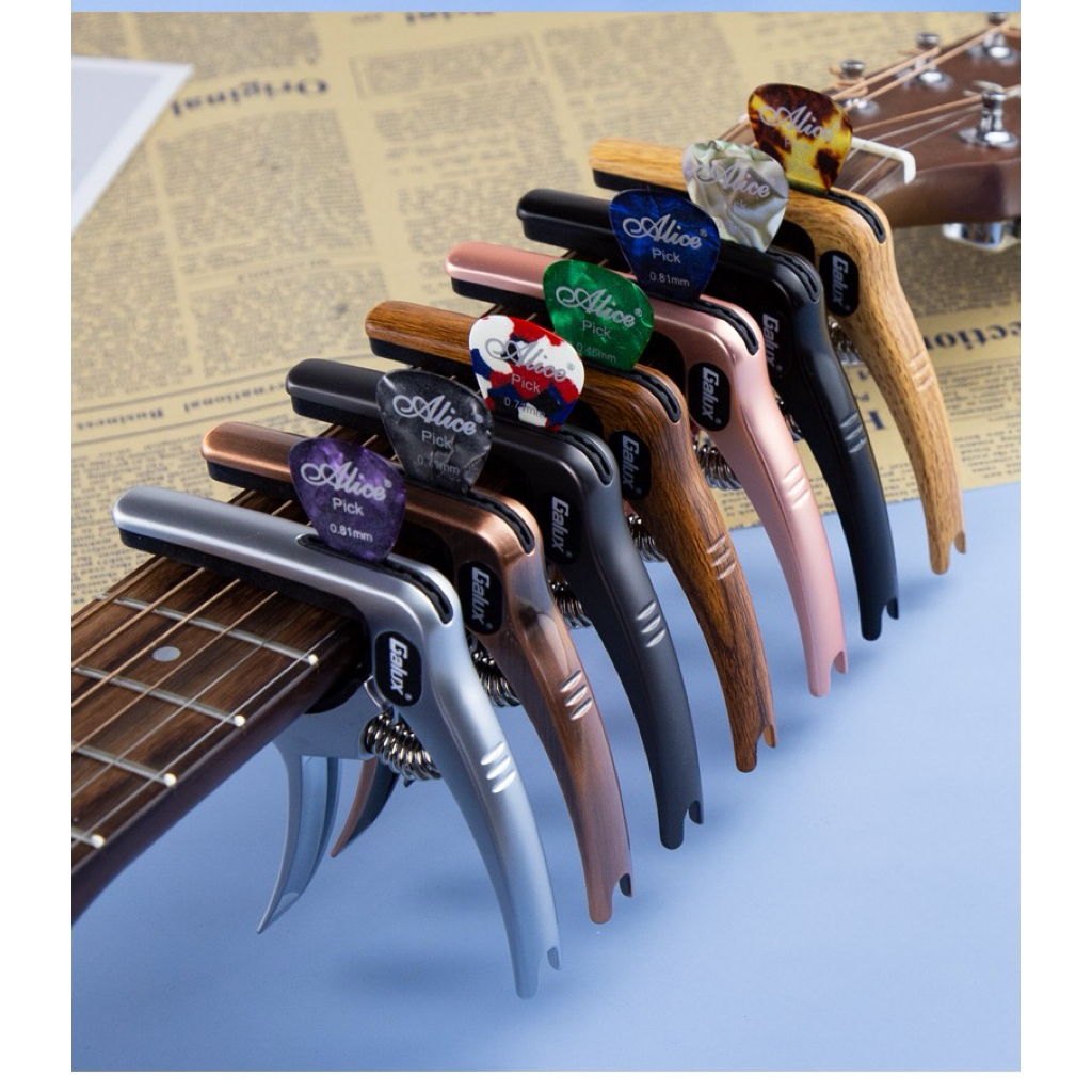 Capo Galux รุ่นใหม่ เสียบปิ้คได้จ้า มี 6สีให้เลือกงานคุณภาพสุดๆรับรองไม่ผิดหวังมีถุงผ้าใส่กันรอยด้วยน่ะค่ะ1 ถุง