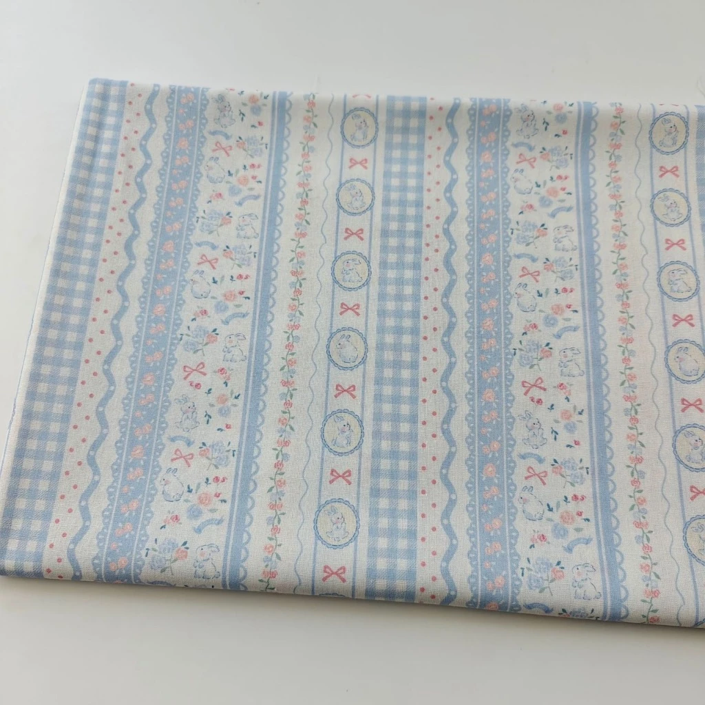 ผ้าคอตตอน 100% cotton poplin ตัดขายเป็นเมตร หน้ากว้าง 145 เซนติเมตร ลาย Rabbit bow flower