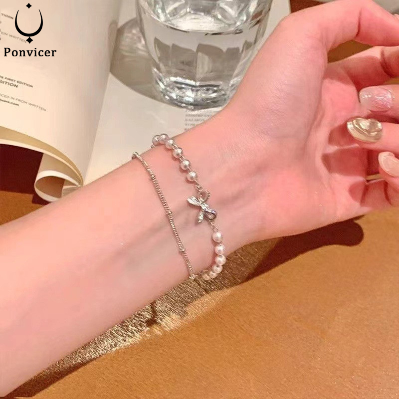 สร้อยข้อมือมุกโบว์สองชั้น เครื่องประดับหรูหราเบาๆ สร้อยข้อมือดีไซน์เก๋ไก๋ สำหรับผู้หญิง