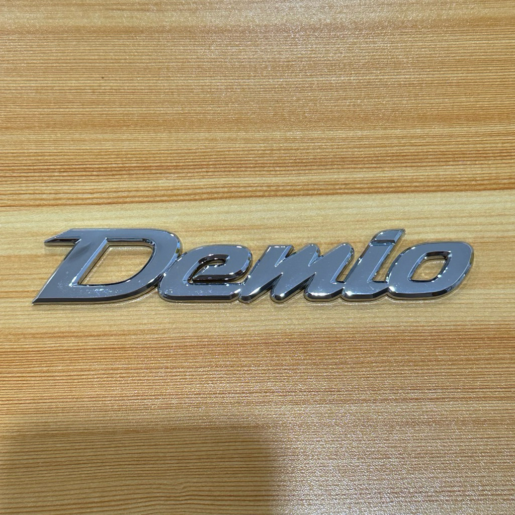 โลโก้ Demio ติดรถ Mazda ขนาด 2.8 x 15.5 cm ราคาต่อชิ้น วัสดุ พลาสติก ABS อย่างดี