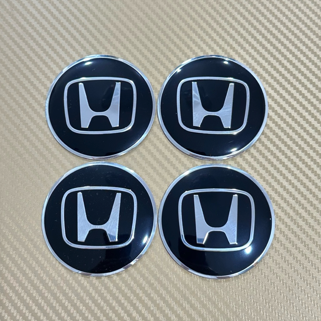 โลโก้  HONDA ขอบเงิน โลโก้ฝาครอบล้อ โลโก้ติดดุมล้อ ขนาด : เส้นผ่าศูนย์กลาง 65 mm (ราคาต่อชุด มี 4 ชิ้น )