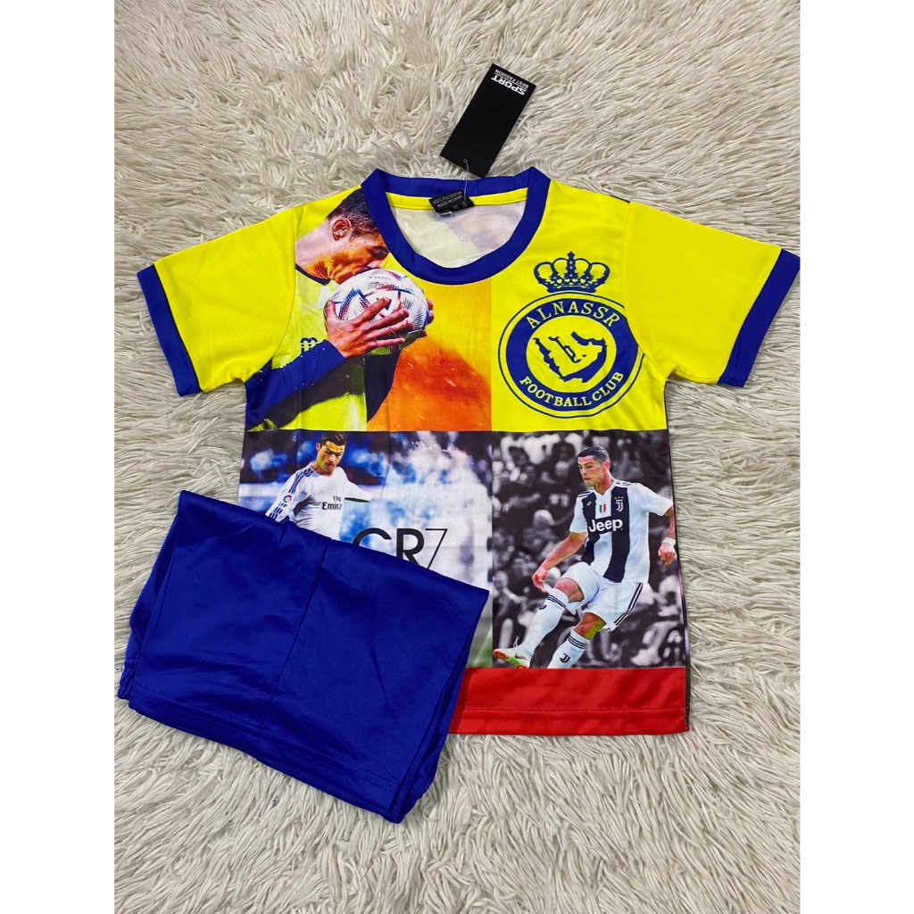 เสื้อกีฬาบอลเด็กเรอัลมาดริดพร้อมลายเซ็นโรนัลโด้ ใหม่ล่าสุด เสื้อ+กางเกง ปี2025-2026