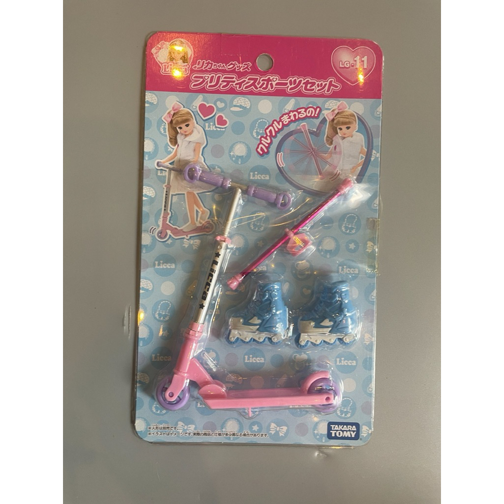 Licca-chan dolls featuring:  A pink kick scooter.