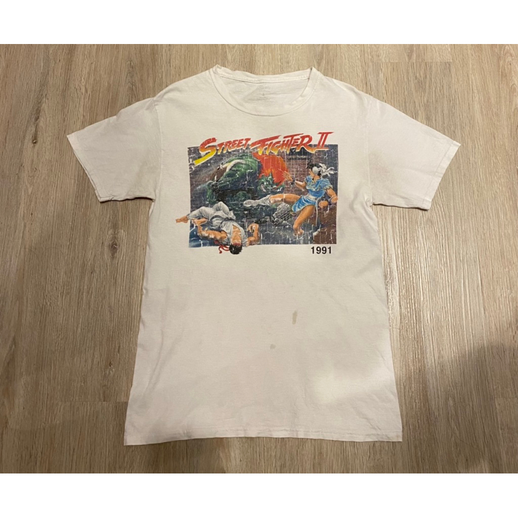 รหัสC2 เสื้อวินเทจStreet Fiighter II สภาพ: 9/10 ขนาด: อก 38-40นิ้ว ตำหนิ: เปื้อน 1จุด ราคา: 250บาท 💖