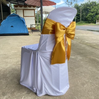 ผ้าคลุมเก้าอี้ พร้อมโบว์ต่วนสีทอง ผ้าสวมเก้าอี้ ผ้าคลุมเก้าอี้พลาสติก (รุ่นปกติจีบข้าง) ใช้สำหรับงานพิธี งานแต่ง อื่นๆ