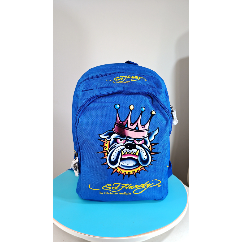 Ed Hardy:กระเป๋าเป้สะพายหลังผ้าแคนวาส สีฟ้าคลายน์ ลายหมาดุ ดีไซน์เท่ ทนทาน ใส่ของได้เยอะ